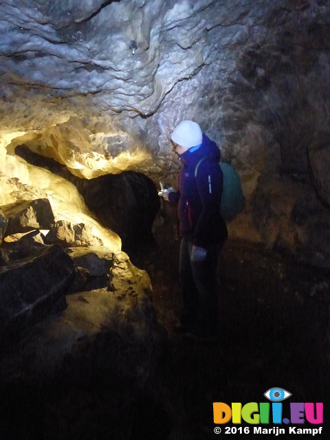 FZ025920 Jenni walking in Carreg Cennen Castle cave